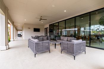 outdoor patio lounging area at Reveal at Onion Creek apartments